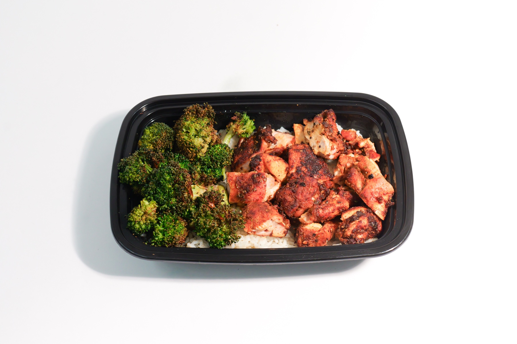 Little Chicken meal prep boxes with rice and broccoli